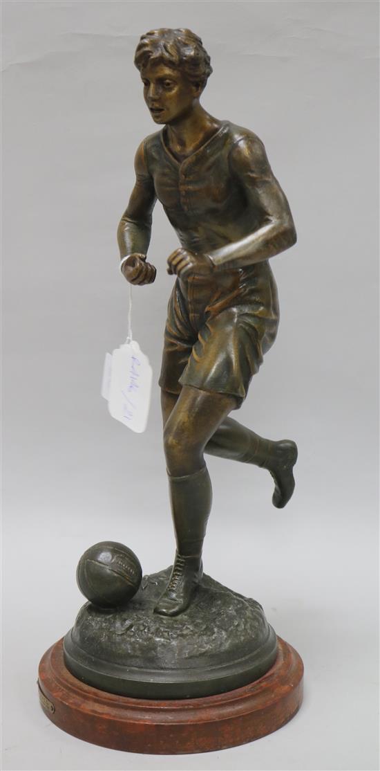 A spelter figure of a footballer, signed Guillemin